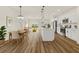Open-concept living space with modern kitchen, dining area, and seamless access to the backyard at 4774 Sw 142Nd Place Rd, Ocala, FL 34473