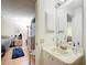 Bathroom with a sink and vanity next to the bedroom at 480 Hildalgo Dr, The Villages, FL 32159