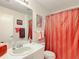 Functional bathroom featuring a single sink vanity and a shower with a curtain at 480 Hildalgo Dr, The Villages, FL 32159