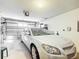 Spacious garage with a car inside and an automatic door opener at 480 Hildalgo Dr, The Villages, FL 32159