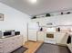 Well-lit kitchen with white cabinets, laminate countertops, and matching appliances at 480 Hildalgo Dr, The Villages, FL 32159