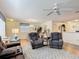 Comfortable living room area, featuring wood floors and an inviting atmosphere at 480 Hildalgo Dr, The Villages, FL 32159
