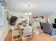 Open-concept living space that combines dining, living, and kitchen areas for easy entertaining at 480 Hildalgo Dr, The Villages, FL 32159