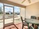 Relaxing screened patio with outdoor seating and view of the landscaped backyard and neighborhood at 480 Hildalgo Dr, The Villages, FL 32159