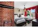 Whimsical themed bedroom features twin beds, unique brick accent wall, and decorative lighting at 5117 Killarney Way, Kissimmee, FL 34746