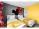 The bedroom showcases two twin beds, decorative curtains and a gray accent wall at 5117 Killarney Way, Kissimmee, FL 34746