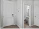 Clean entryway leads to half-bath with a pedestal sink, tile floors, and white doors and trim at 5117 Killarney Way, Kissimmee, FL 34746