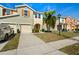 Charming townhome with well-maintained landscaping, a driveway and a welcoming curb appeal at 5117 Killarney Way, Kissimmee, FL 34746