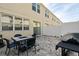 Outdoor patio area with pavers, a dining table and a grill, perfect for relaxation and entertainment at 5117 Killarney Way, Kissimmee, FL 34746