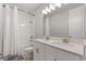Elegant bathroom with double sinks, a modern vanity, and a shower-tub combination with white tile at 543 Wishbone Ln, Lake Mary, FL 32746