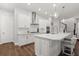 Beautiful kitchen with modern island, range hood, and pendant lights at 543 Wishbone Ln, Lake Mary, FL 32746