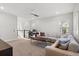 Spacious living room featuring neutral tones, ample natural light, and stylish, comfortable seating at 543 Wishbone Ln, Lake Mary, FL 32746
