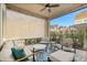 Inviting covered patio with cozy seating, stylish rug, and charming string lights for outdoor relaxation at 543 Wishbone Ln, Lake Mary, FL 32746