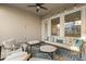 Relaxing covered patio featuring comfortable seating, stylish decor, and ample natural light at 543 Wishbone Ln, Lake Mary, FL 32746