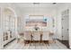 Dining room featuring modern lighting and neutral decor at 571 N Lake Sybelia Dr, Maitland, FL 32751