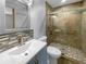 Beautiful bathroom featuring a single sink vanity and enclosed glass shower with tiled walls and pebble floor at 6 Almond Trce, Ocala, FL 34472