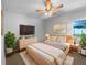 Cozy bedroom featuring a neutral color palette, stylish decor, and a ceiling fan at 6 Almond Trce, Ocala, FL 34472