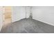 Bedroom featuring an ensuite bathroom, soft gray carpet, and a walk in closet at 6003 W Harwood Ave, Orlando, FL 32835