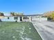 Charming single-story home featuring a well-manicured lawn and a covered carport at 6003 W Harwood Ave, Orlando, FL 32835