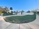 Well-maintained front yard with a green lawn and concrete driveway at 6003 W Harwood Ave, Orlando, FL 32835