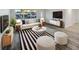 Bright and airy living room with stylish furniture, decor, and wood-look flooring at 6003 W Harwood Ave, Orlando, FL 32835