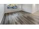 Inviting living room with wood-look flooring and great natural light at 6003 W Harwood Ave, Orlando, FL 32835