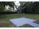 Expansive backyard featuring a brick patio area, mature trees and lots of open green space at 613 20Th St, Orlando, FL 32805