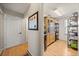 Hallway leads to bright pantry with built-in storage and shelving for organization at 6743 Cherry Grove Cir, Orlando, FL 32809