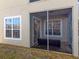 Screened-in back porch of a cozy home, perfect for relaxing and enjoying the outdoors at 6936 Della Dr # 33, Orlando, FL 32819