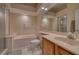 Bathroom with a soaking tub, separate shower, and spacious vanity, providing a luxurious experience at 6936 Della Dr # 33, Orlando, FL 32819