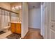 Bathroom featuring a vanity and mirror with access to the bedroom and closet at 6936 Della Dr # 33, Orlando, FL 32819