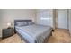 Comfortable bedroom with neutral walls, carpeted floors, closet and access to the hallway at 6936 Della Dr # 33, Orlando, FL 32819