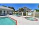 Community pool area featuring a jacuzzi, lounge chairs and community pool at 6936 Della Dr # 33, Orlando, FL 32819