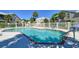 Sparkling community pool surrounded by well-maintained landscaping and comfortable seating area at 6936 Della Dr # 33, Orlando, FL 32819