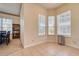 Bright dining nook with large windows, a bookcase, and tiled floors, creating an inviting eating space at 6936 Della Dr # 33, Orlando, FL 32819