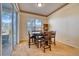 Well-lit dining room featuring a table set for four, sliding glass doors to patio, and stylish decor at 6936 Della Dr # 33, Orlando, FL 32819