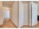 Hallway with neutral walls and carpet leads to doorways and provides access throughout the home at 6936 Della Dr # 33, Orlando, FL 32819