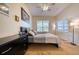 Spacious main bedroom featuring a large bed, a whiteboard, and a window for natural light at 6936 Della Dr # 33, Orlando, FL 32819