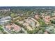 Aerial view of a suburban community with mature trees and vibrant landscaping at 696 Seabrook Ct # 101, Altamonte Springs, FL 32714