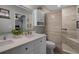 Modern bathroom featuring dual sinks, stylish tile shower, and contemporary fixtures at 696 Seabrook Ct # 101, Altamonte Springs, FL 32714