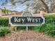 Key West condominium community sign surrounded by lush greenery at 696 Seabrook Ct # 101, Altamonte Springs, FL 32714