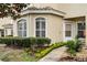 Home exterior with manicured landscaping, sidewalk, and covered entryway at 696 Seabrook Ct # 101, Altamonte Springs, FL 32714
