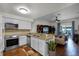 Kitchen features stainless steel appliances, granite countertops, and open floor plan at 696 Seabrook Ct # 101, Altamonte Springs, FL 32714