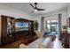 Living room showcasing hardwood floors, entertainment center, and natural light at 696 Seabrook Ct # 101, Altamonte Springs, FL 32714