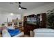 Spacious living room shows hardwood floors, ceiling fan, and adjacent kitchen space at 696 Seabrook Ct # 101, Altamonte Springs, FL 32714