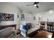Living room features hardwood floors, comfortable seating, and adjacent kitchen at 696 Seabrook Ct # 101, Altamonte Springs, FL 32714