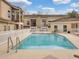 Community pool with a white fence, lounge chairs, and a clear blue pool at 696 Seabrook Ct # 101, Altamonte Springs, FL 32714
