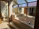 Bright bathroom featuring a jetted tub, tiled shower and a skylight bringing in natural light at 736 Silverwood Dr, Lake Mary, FL 32746
