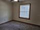 Cozy bedroom with carpeted floors, neutral walls, and a window offering ample natural light at 736 Silverwood Dr, Lake Mary, FL 32746