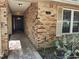 Front exterior view of a brick home featuring the front door and beautiful landscaping at 736 Silverwood Dr, Lake Mary, FL 32746